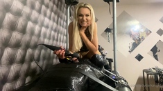 Horny blonde slut in latex fucks pussy with big sex toy