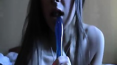 Young Melena swallows blue dildo, making it disappear inside her mouth. Then she slides that dildo lubed with her salive inside her pussy