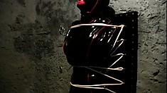 Latex Bound Slave Gets Tied Up To A Wall By Her Freaky Mistress