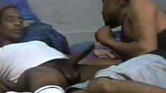 Hot black stud lies on his back and his boyfriend blows his long stick