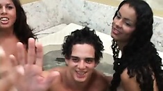 Two hot shemales fucking with a guy in a bathtub